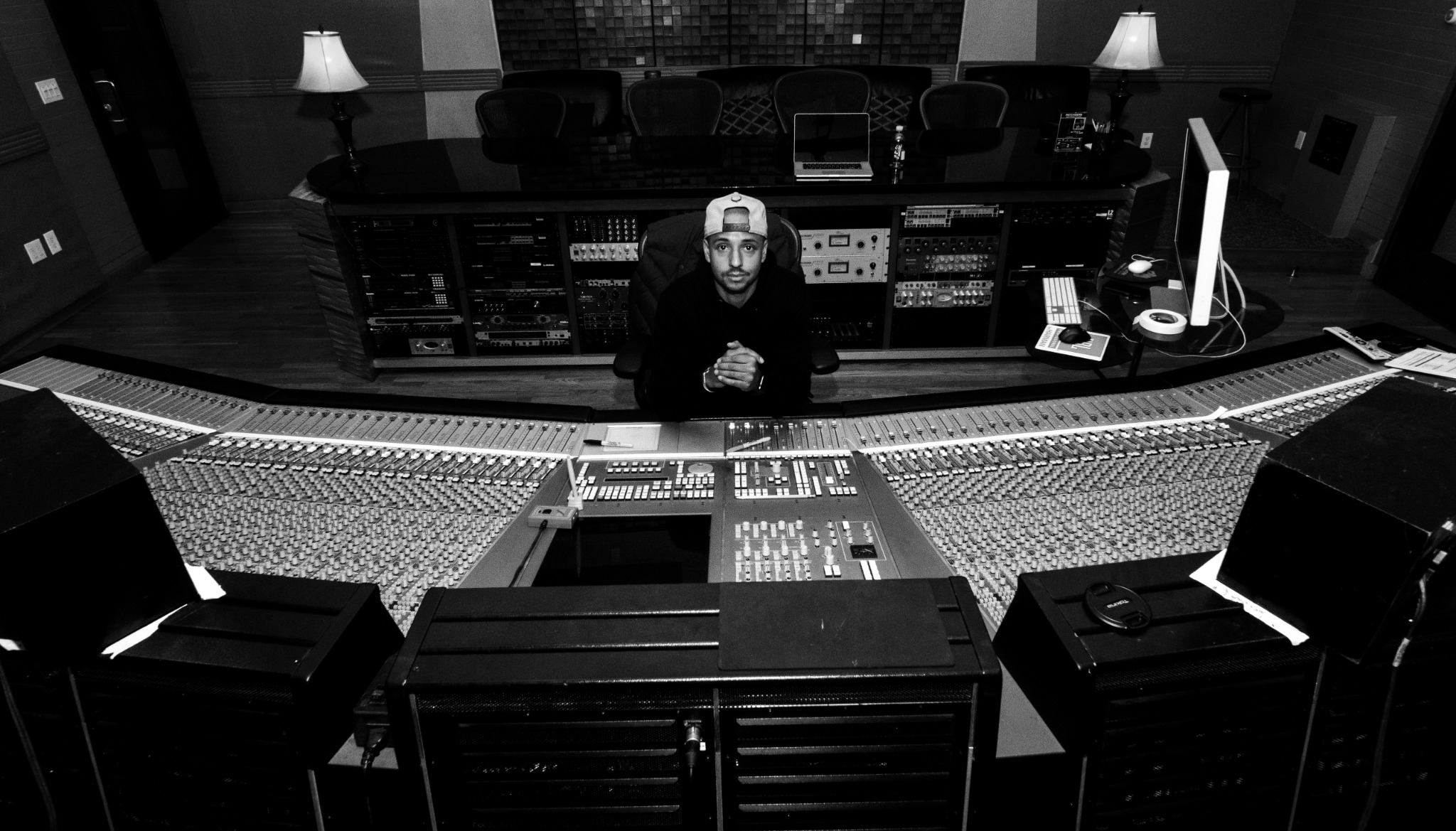 Kori Anders working at a large-format mixing console