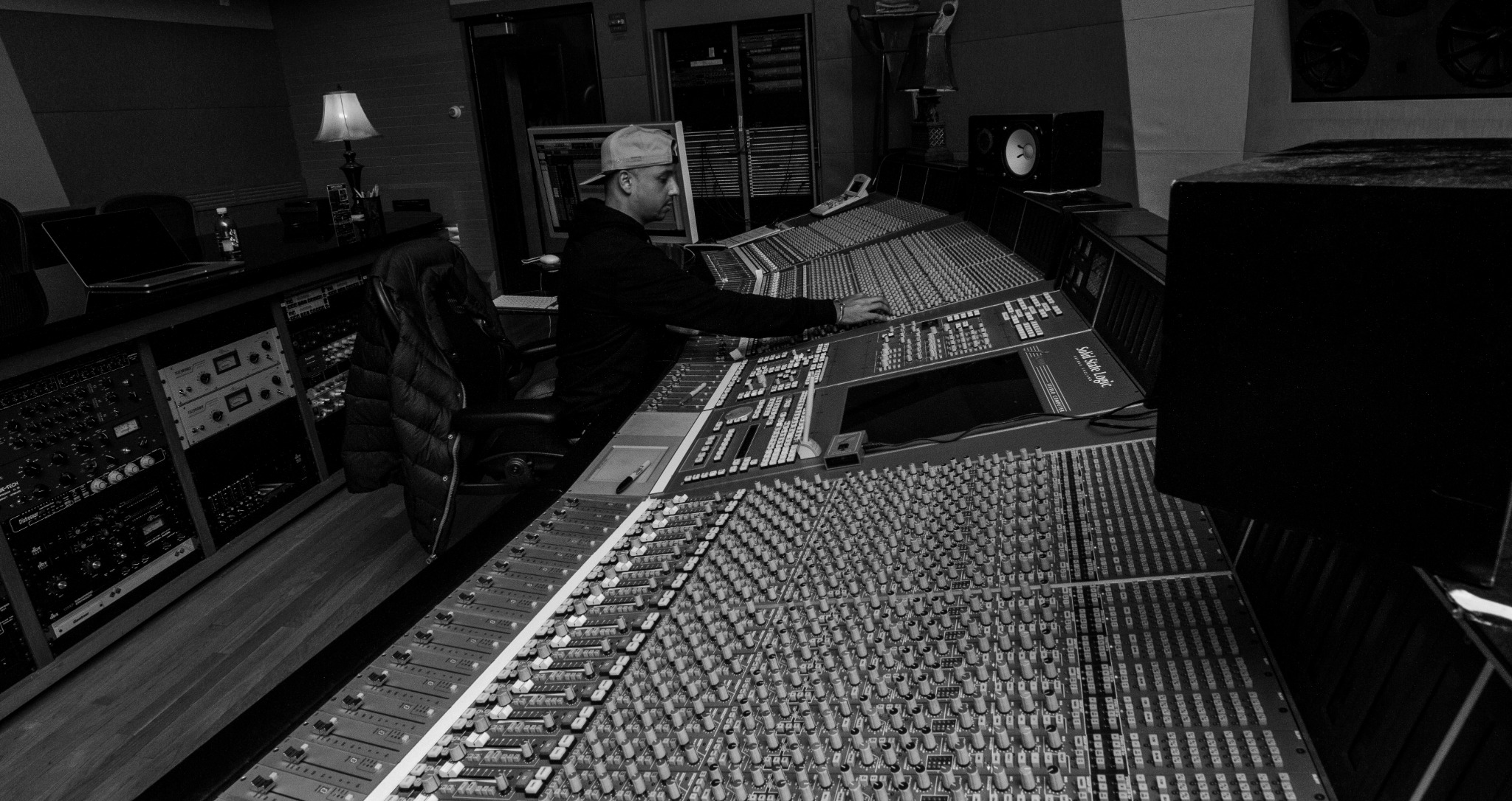 Kori Anders silhouetted while mixing a Pro Tools session